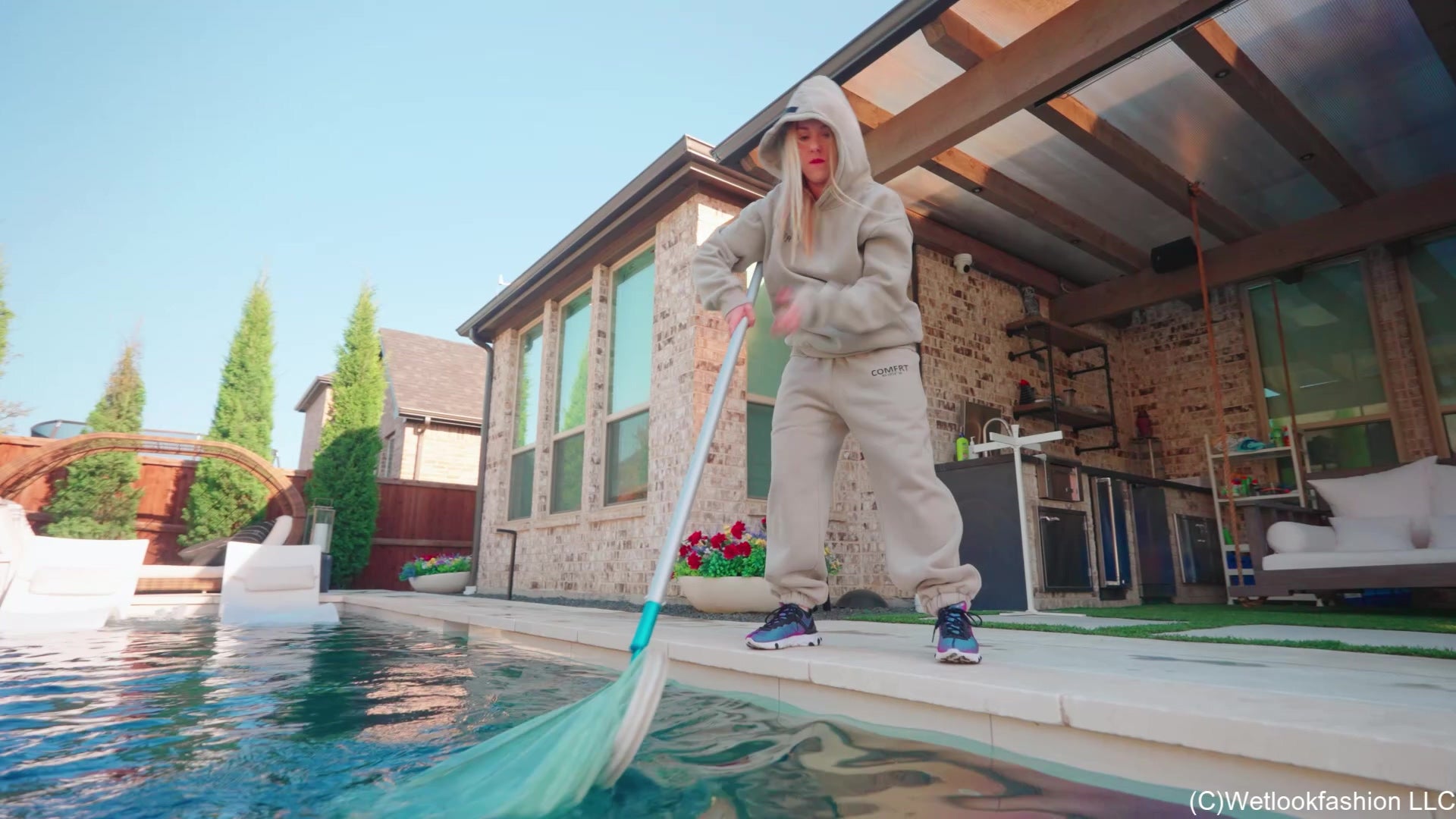 Mandi Falls in the Pool While Cleaning