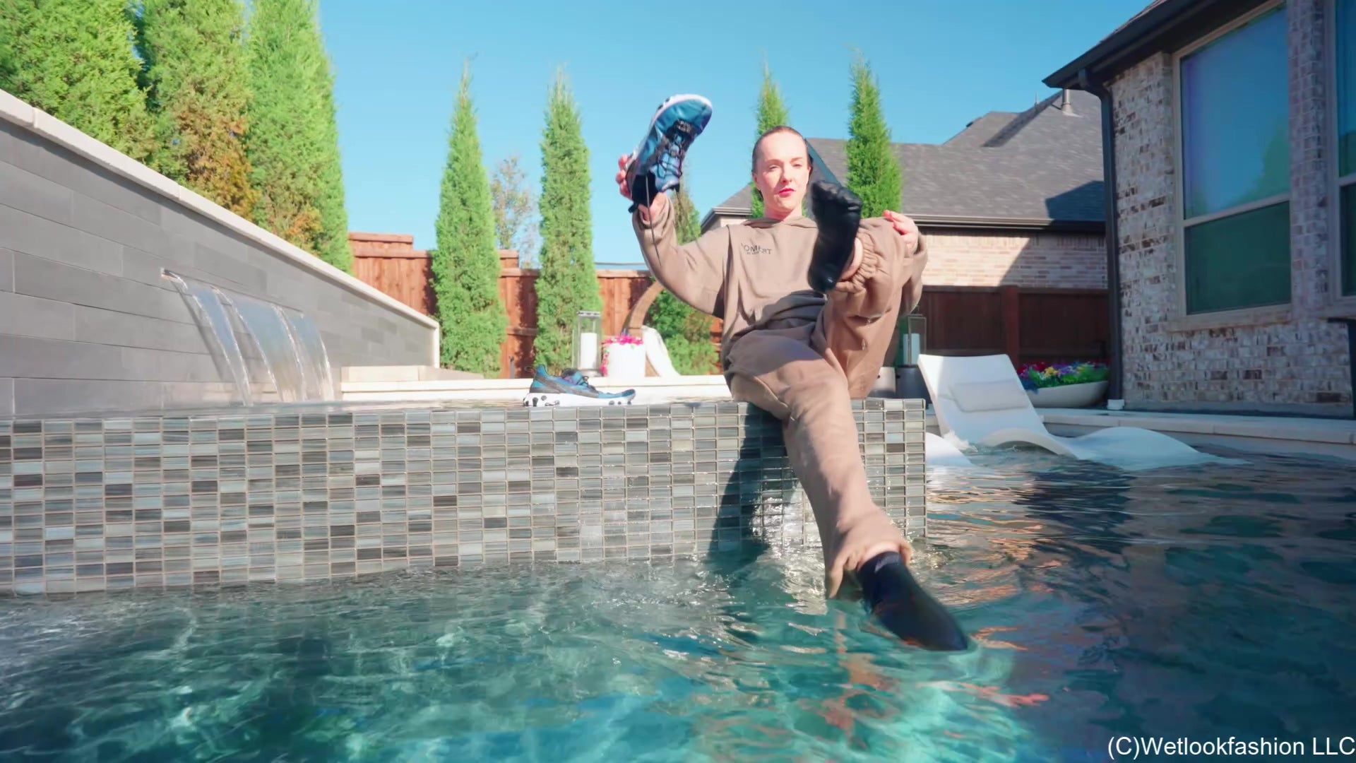 Mandi Falls in the Pool While Cleaning