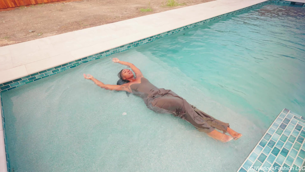 Naomi Is Smoking and Swimming in a Pantsuit