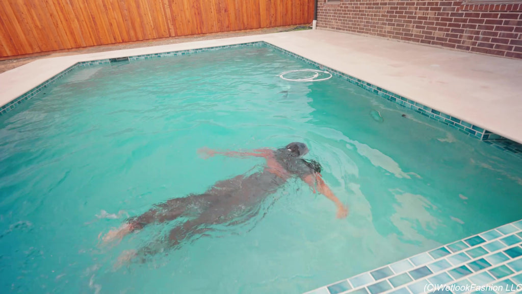 Naomi Is Smoking and Swimming in a Pantsuit