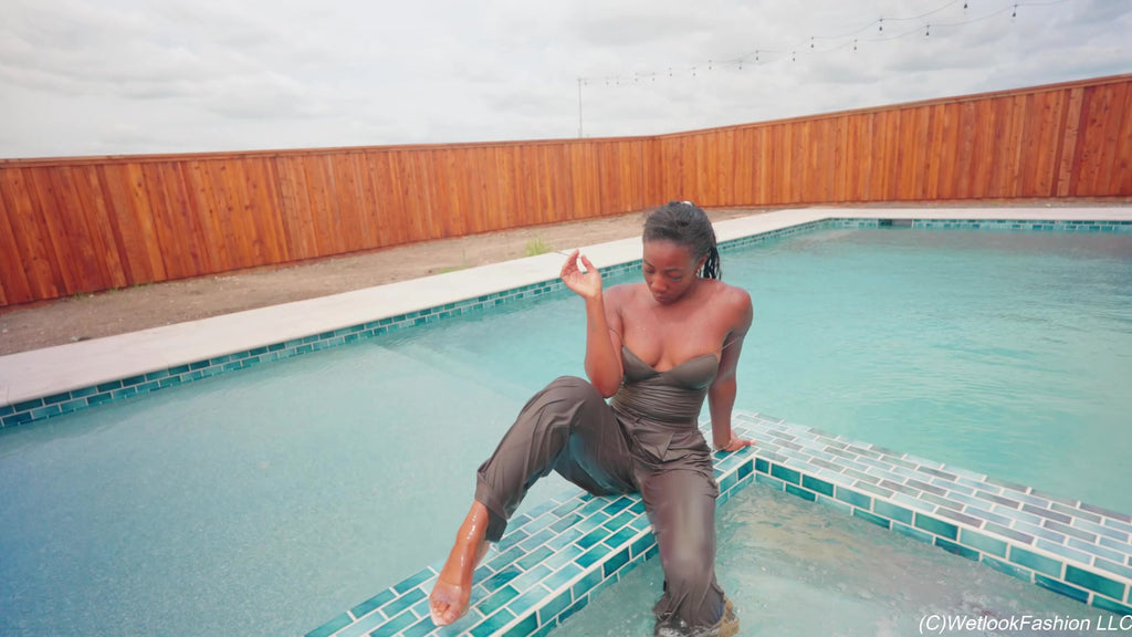 Naomi Is Smoking and Swimming in a Pantsuit