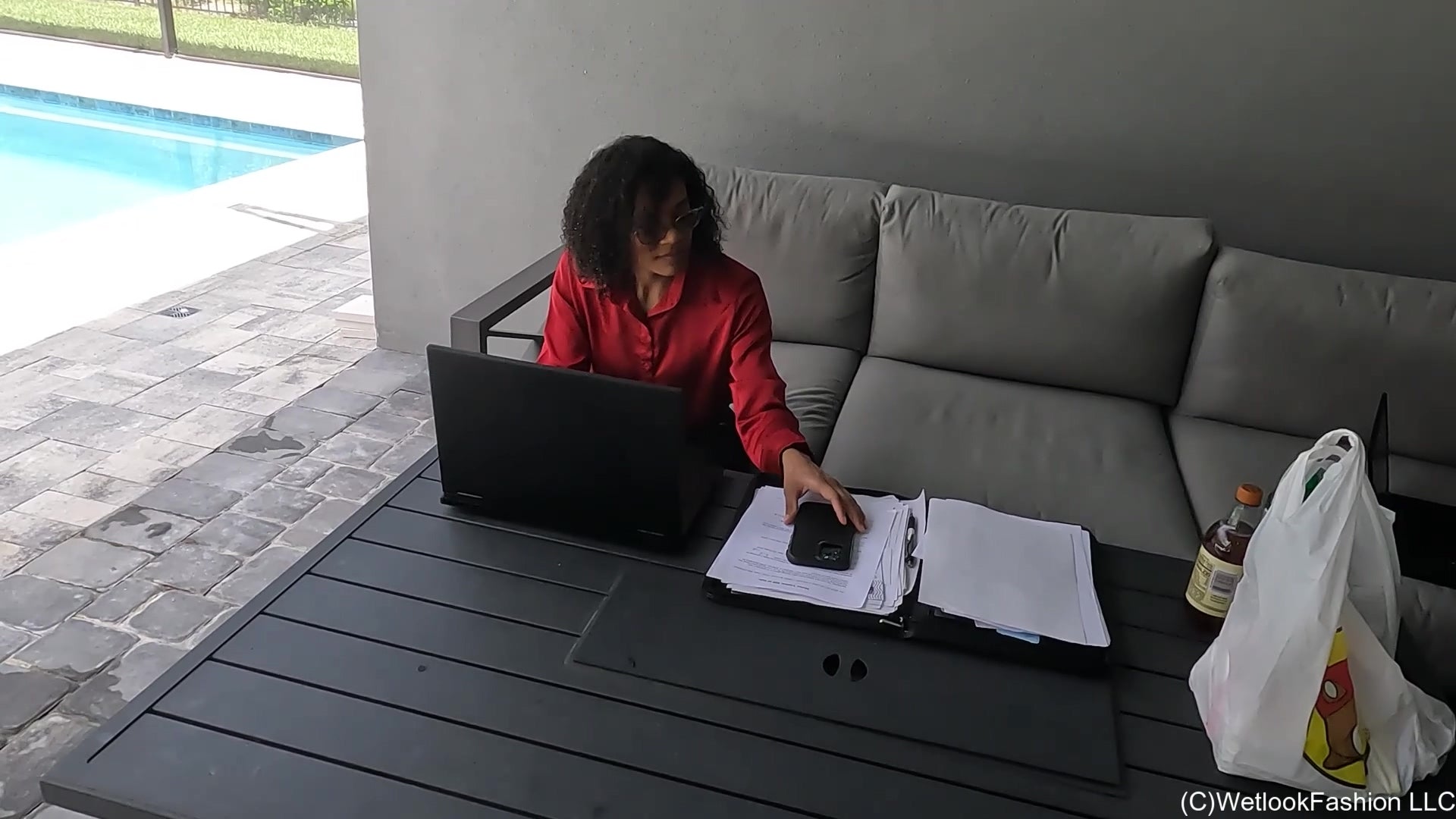 Natalie Swims in a Red and Black Business Outfit