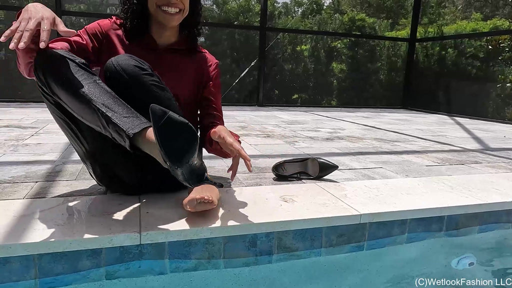 Natalie Swims in a Red and Black Business Outfit