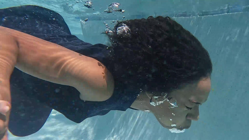 Natalie Swims in Maroon Pants and Sleeveless Shirt
