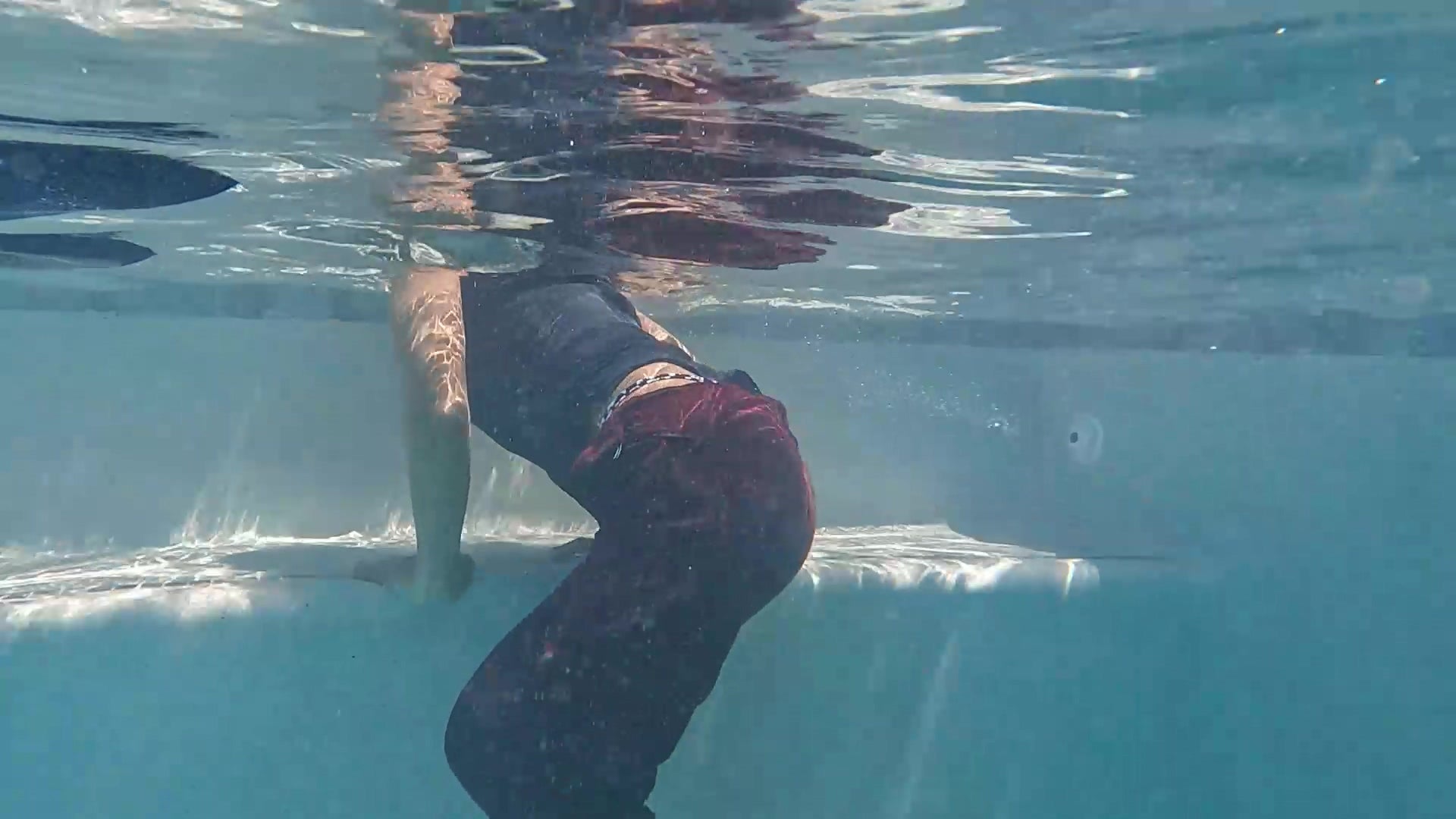 Natalie Swims in Maroon Pants and Sleeveless Shirt