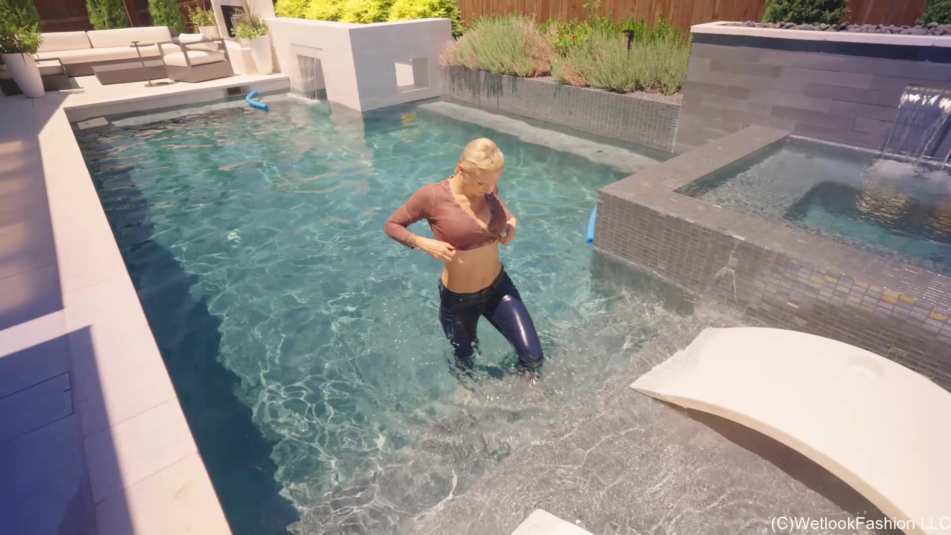 Natasha Gets Wet in a Casual Jeans Outfit