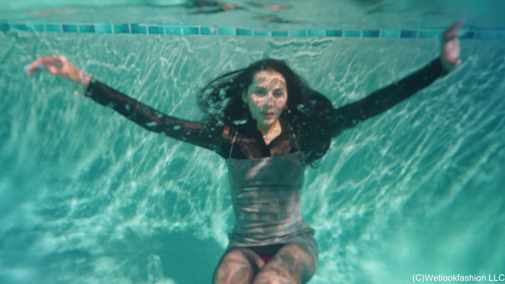 New Model Nicole Swims in a Hot Dress, Tights and Boots