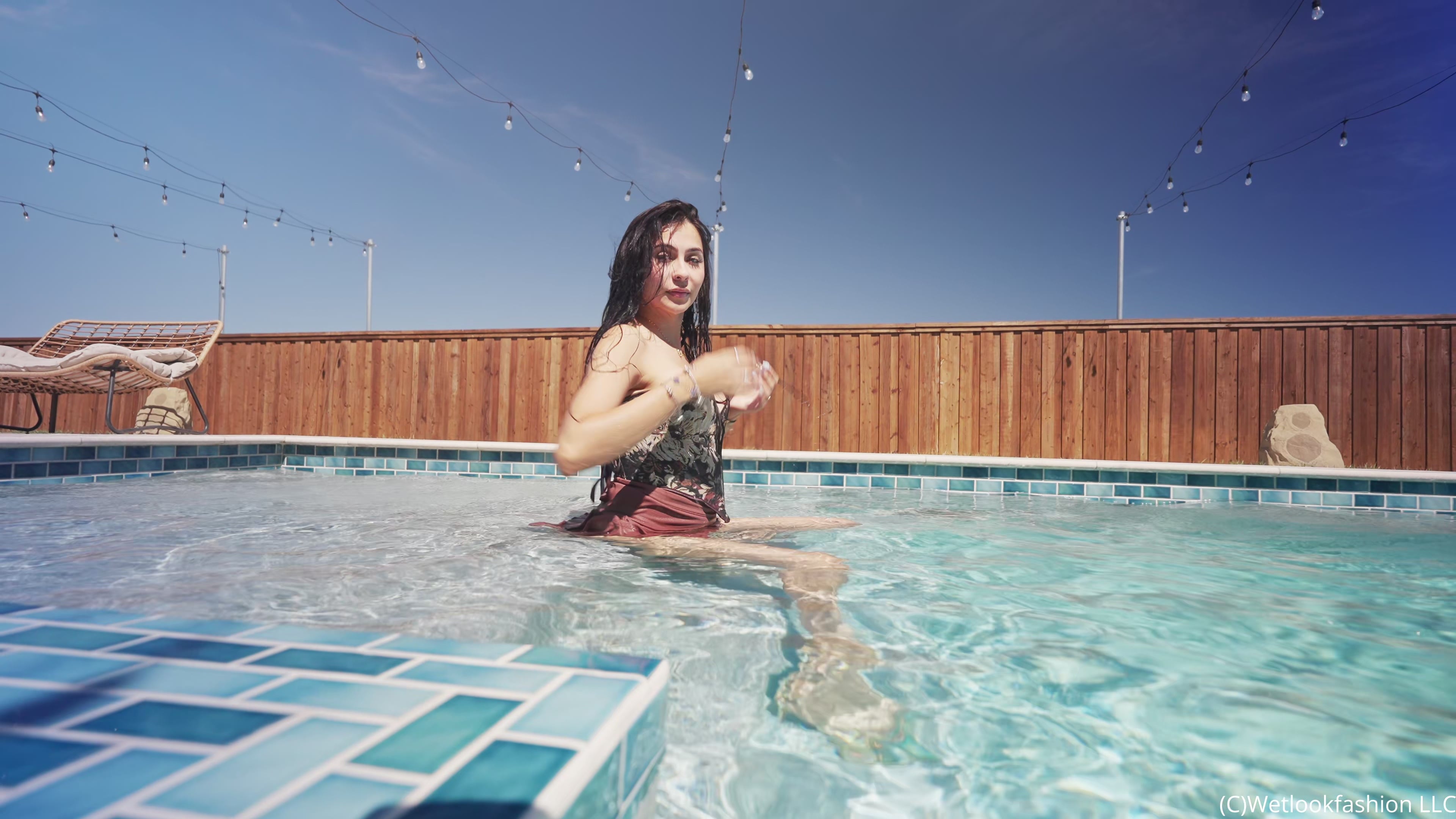 Nicole takes a Dip in a Mini Skirt and a Floral Top