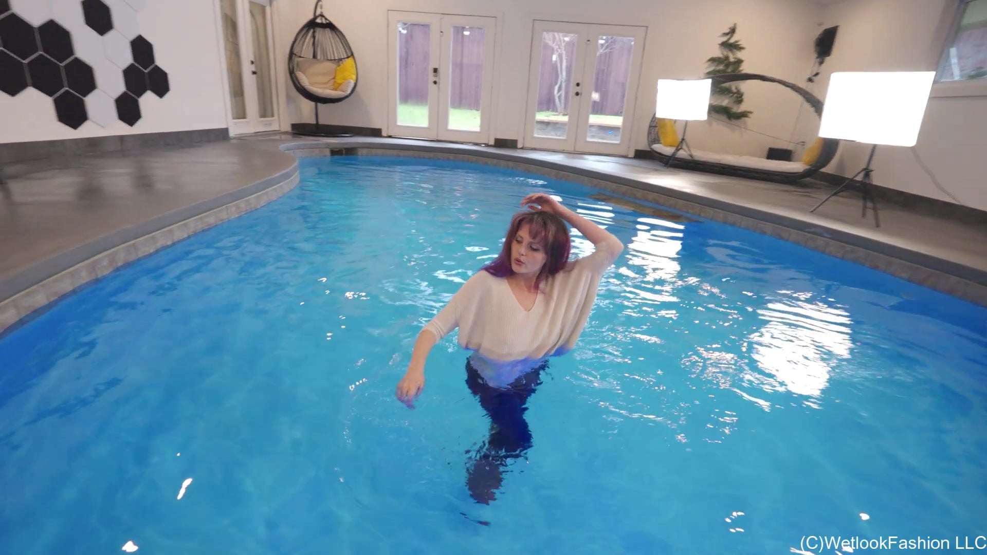 Petra Takes a Dip in Jeans, Sweater and Boots