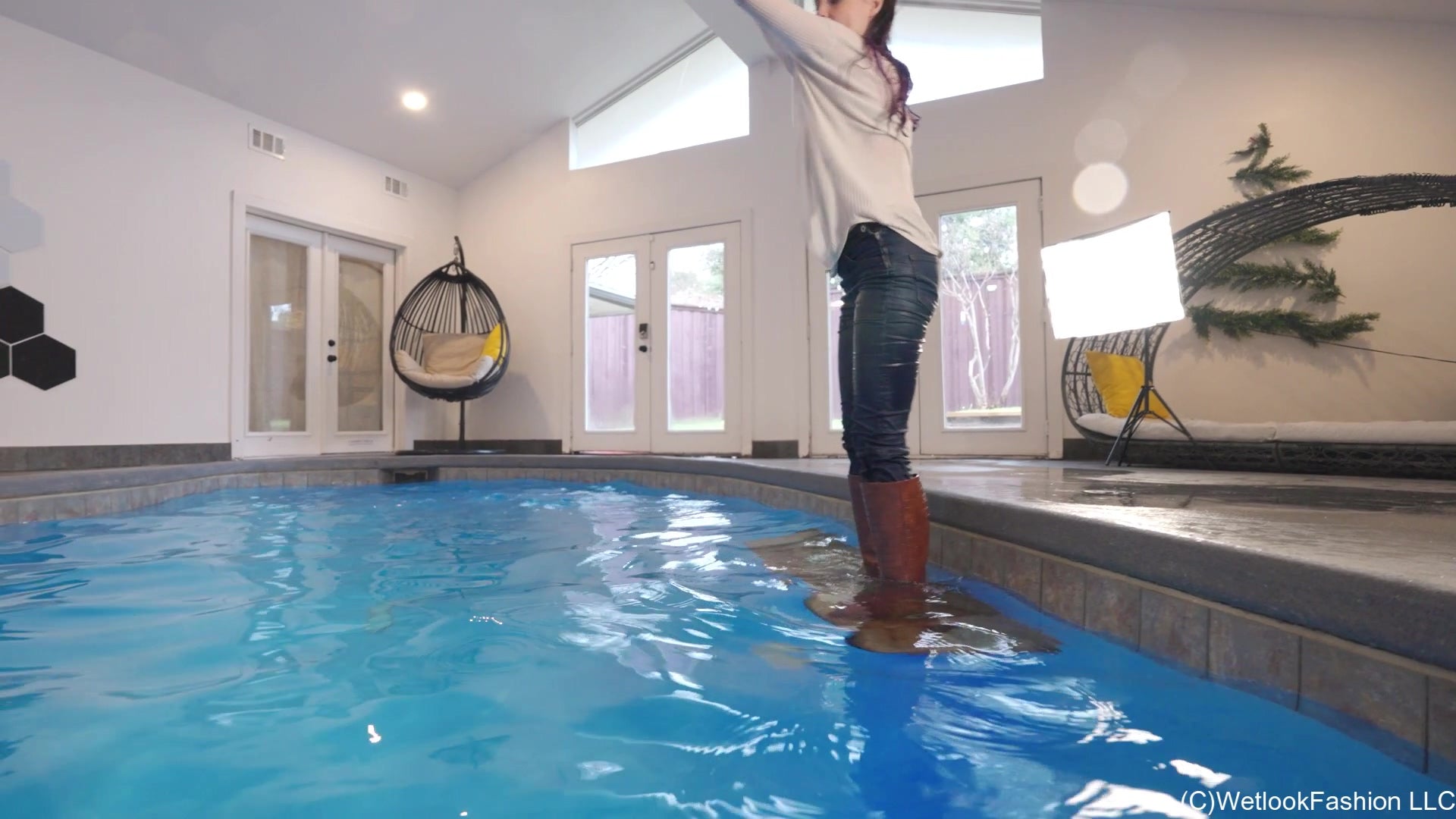 Petra Takes a Dip in Jeans, Sweater and Boots