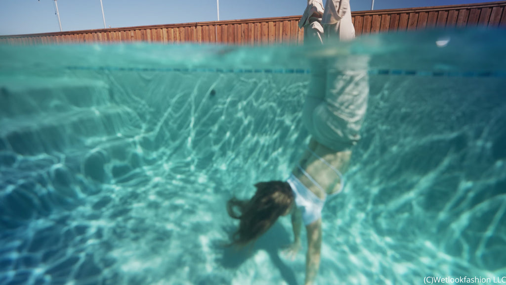 Presley Takes a Dip Wearing Pants, a Crop Top and a Jacket