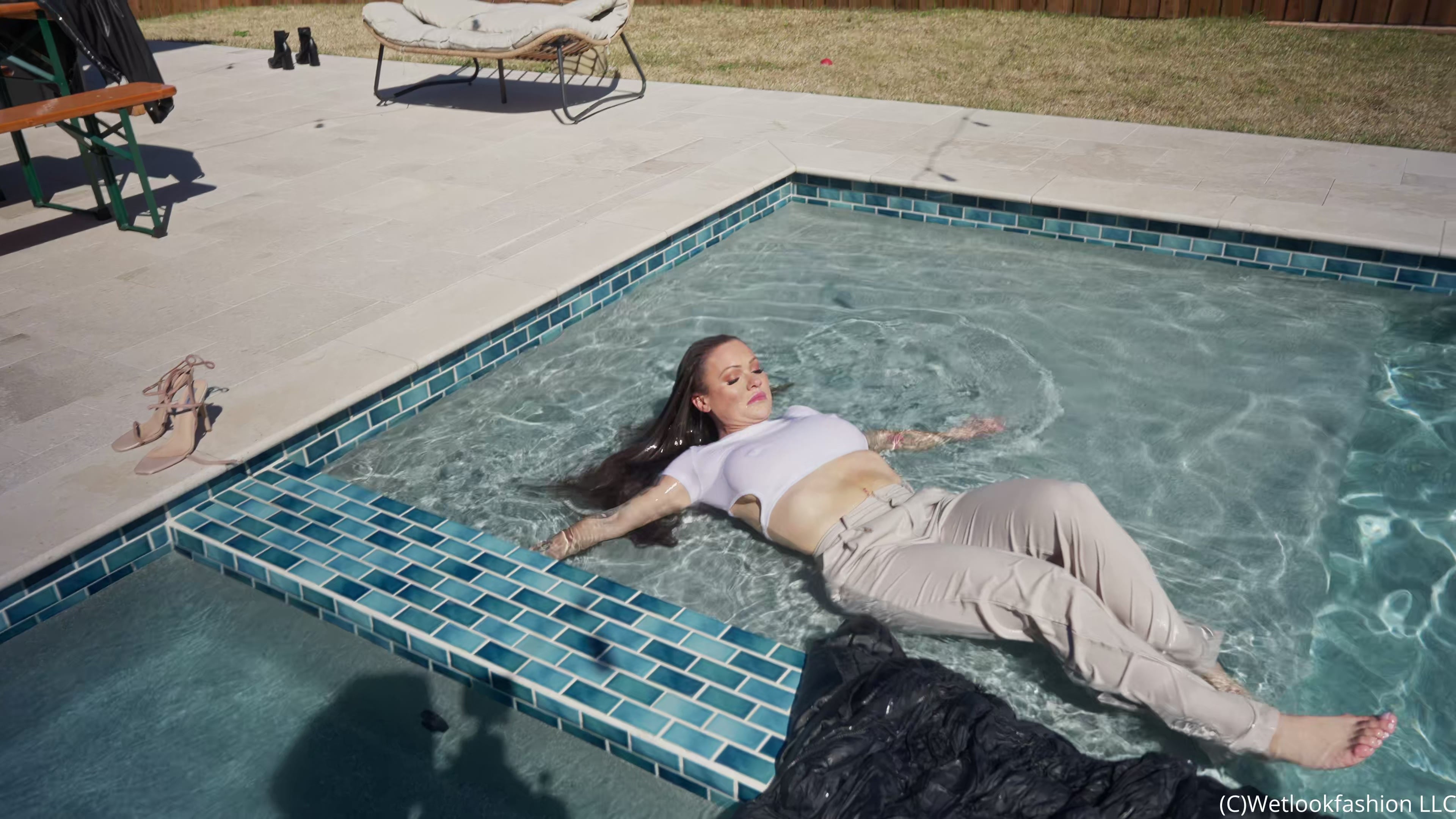 Presley Takes a Dip Wearing Pants, a Crop Top and a Jacket