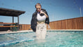 Presley Takes a Dip Wearing Pants, a Crop Top and a Jacket