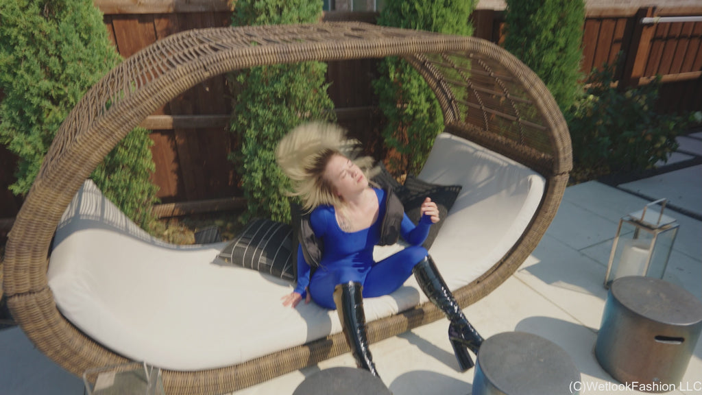 Jessica Takes a Dip Wearing a Jumpsuit, Boots and a Vest