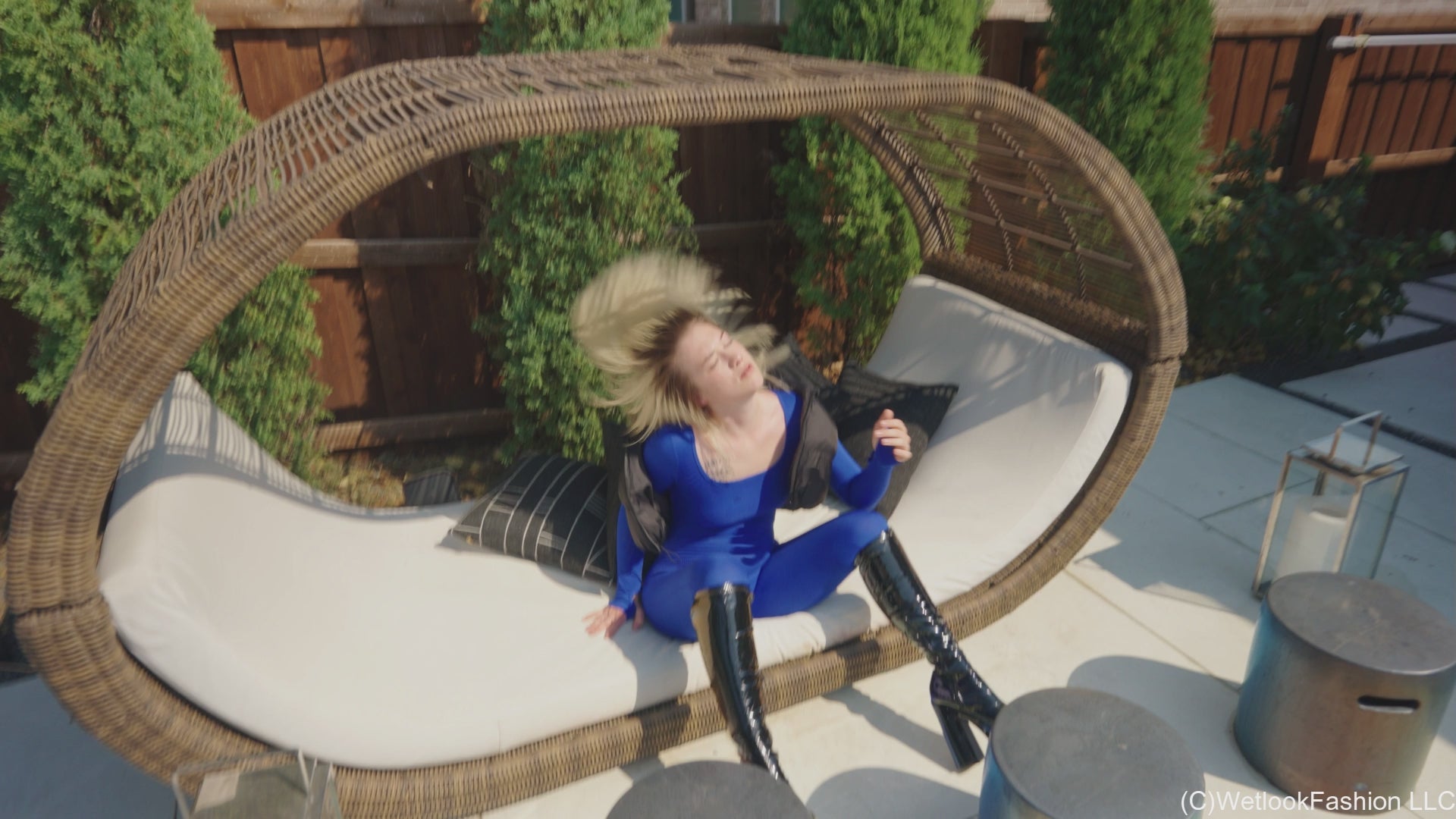 Jessica Takes a Dip Wearing a Jumpsuit, Boots and a Vest