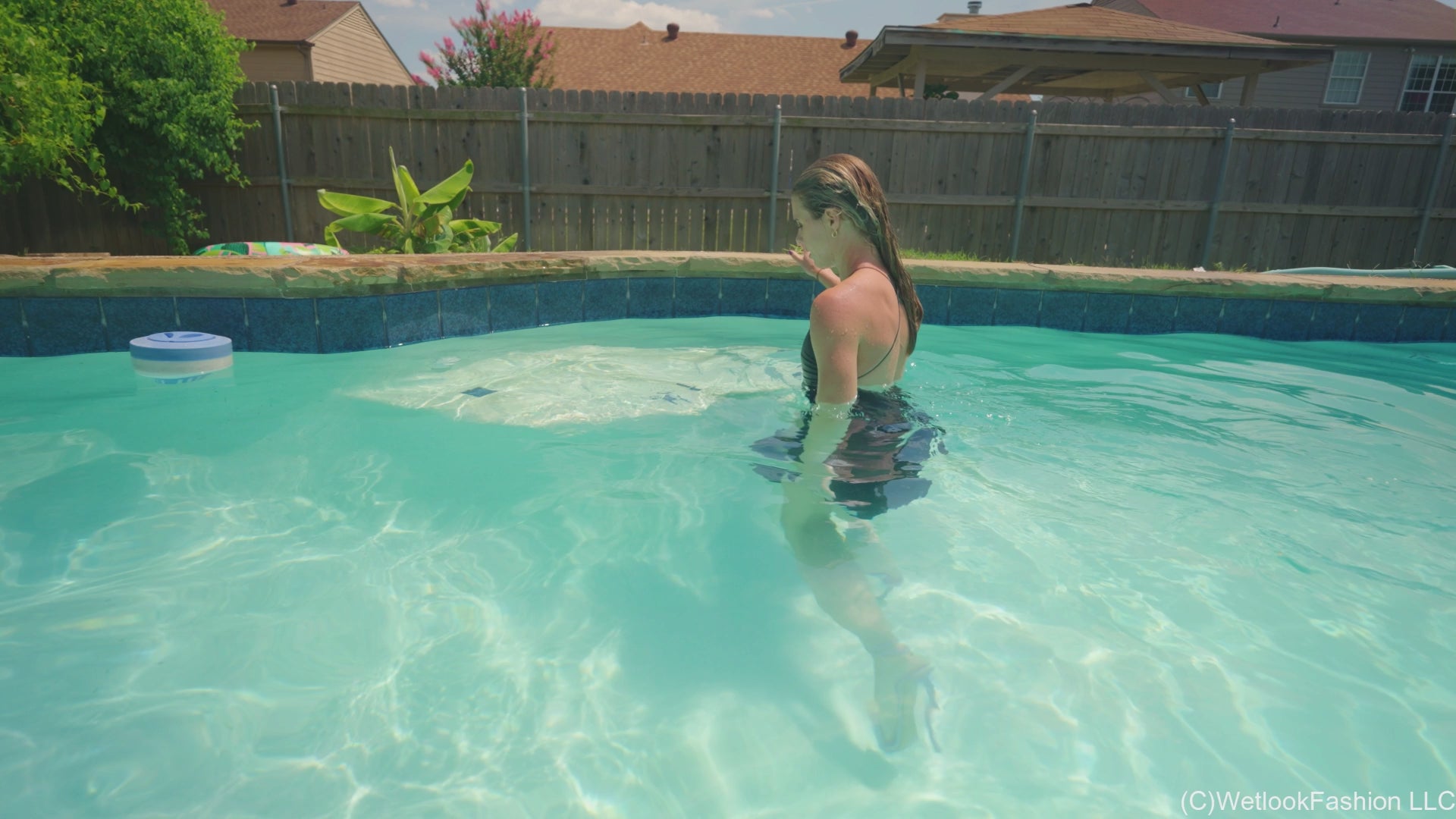 Joy in the Pool Wearing a Black Satin Dress
