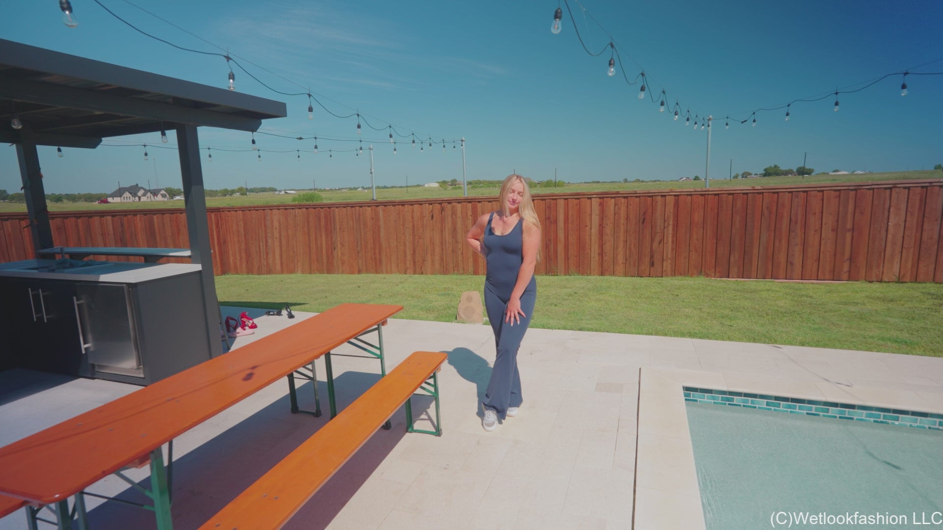 Brinley Swims in a Sporty Jumpsuit and Sneakers