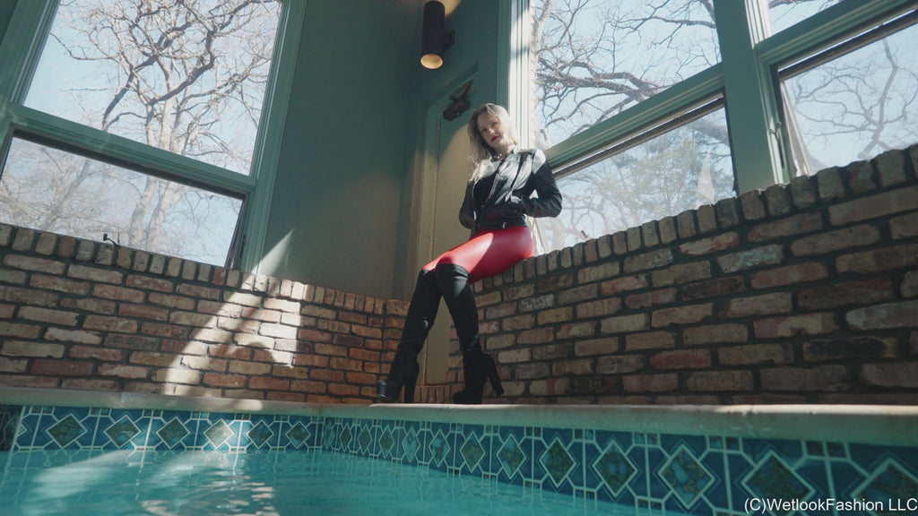 Camille in the Pool Wearing a Red and Black Leather Outfit