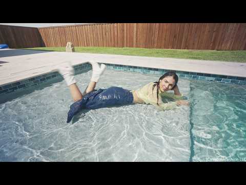 Alexandra Takes a Dip Wearing a Jean Skirt, Top and Boots