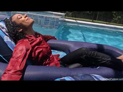 Natalie Swims in a Red and Black Business Outfit