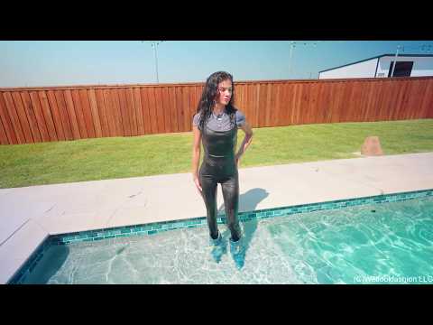 Carla Gets Wet in a Shiny Jumpsuit, Boots and a Shirt