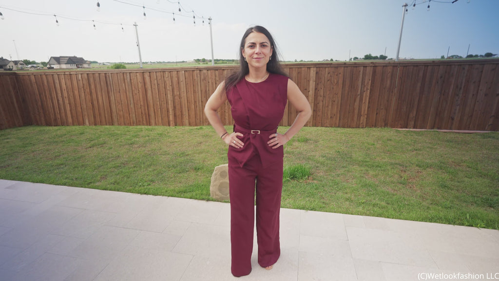 Reina Dives in the Pool Wearing a Pant Suit
