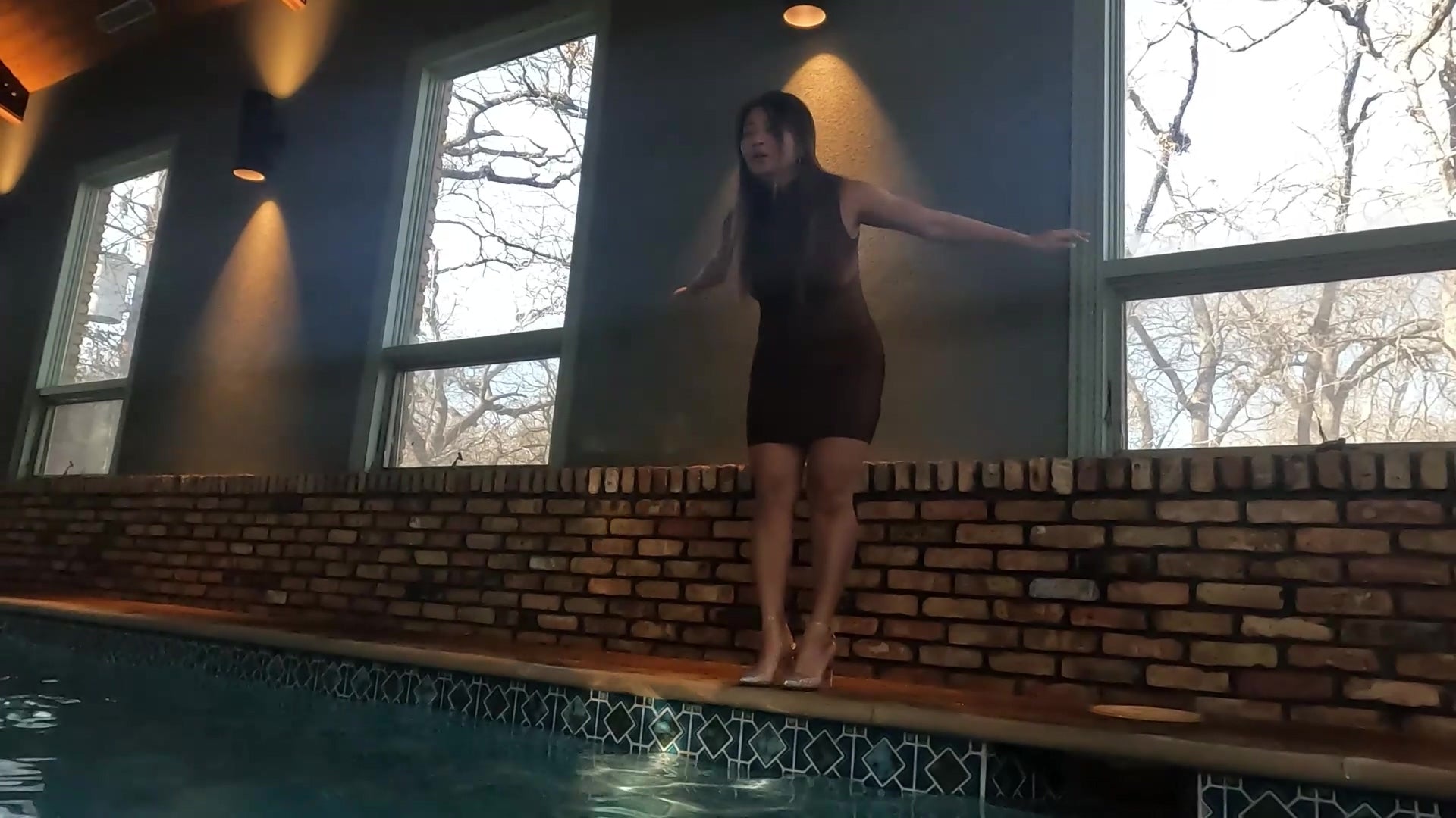 Reyna Jumps in the Pool in Her Clubbing Outfit