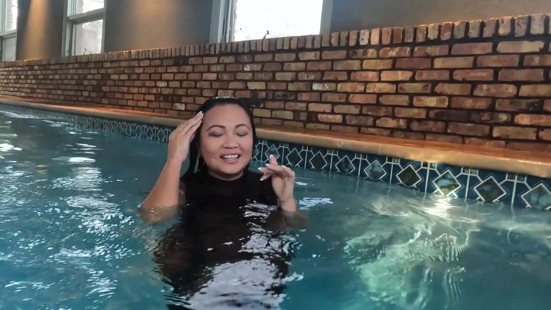 Reyna Jumps in the Pool in Her Clubbing Outfit