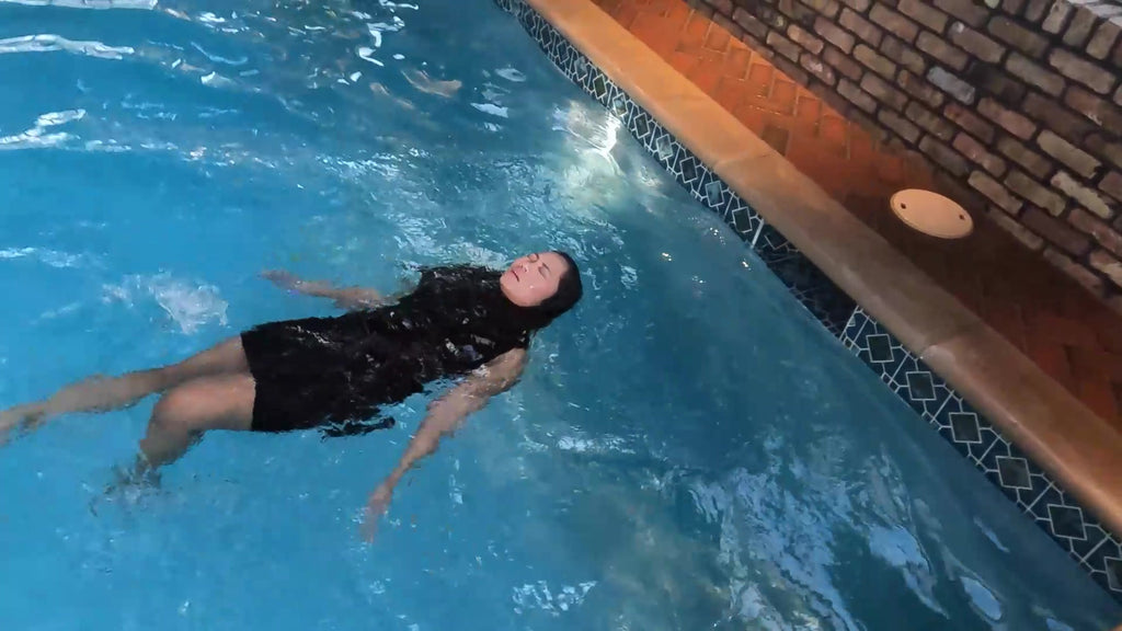 Reyna Jumps in the Pool in Her Clubbing Outfit