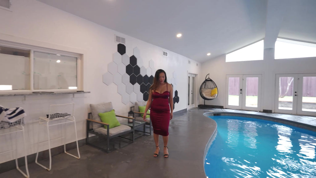 Reyna Relaxing in the Pool Wearing a Red Cocktail Dress
