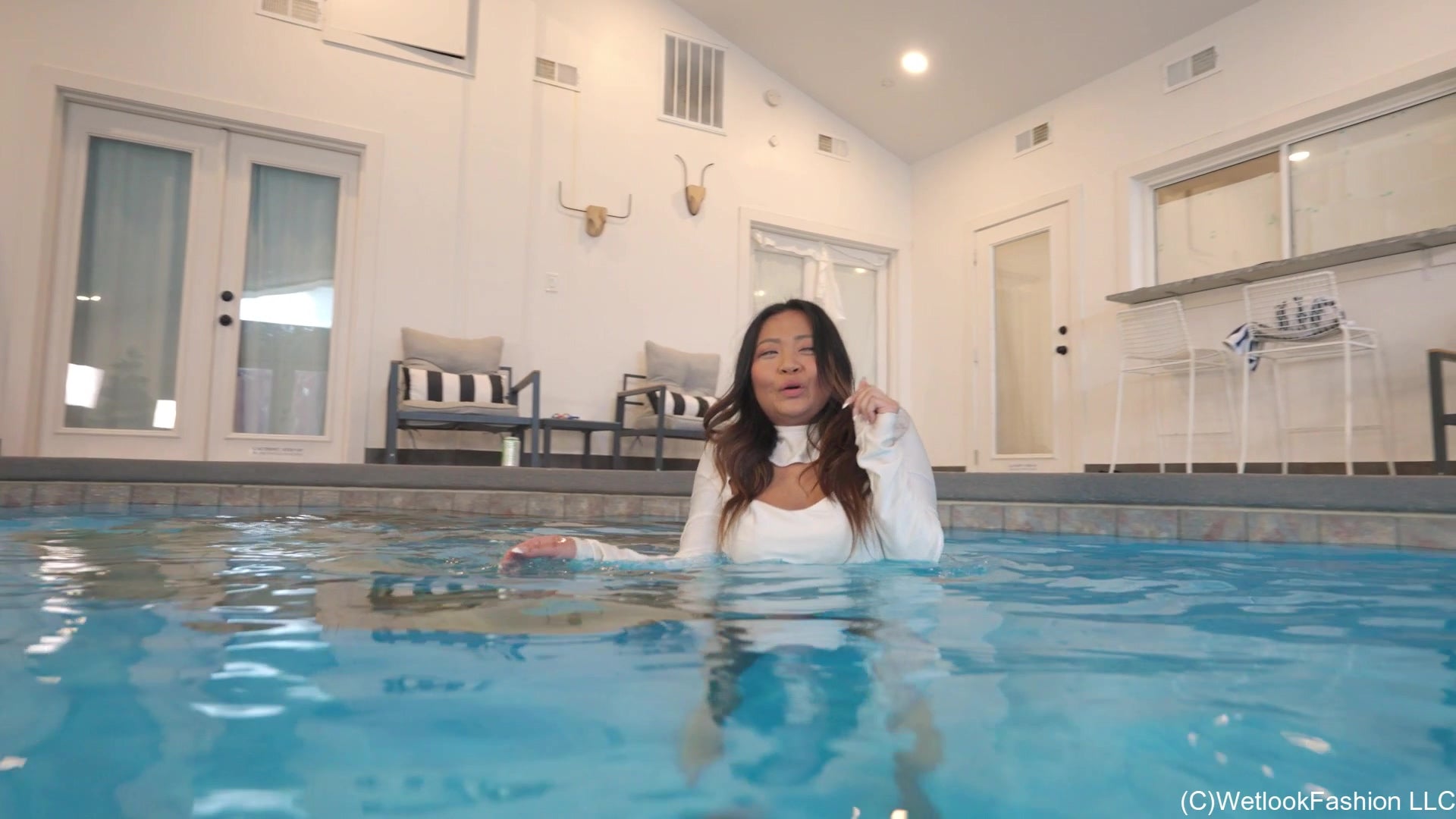 Reyna Swimming in a White Dress