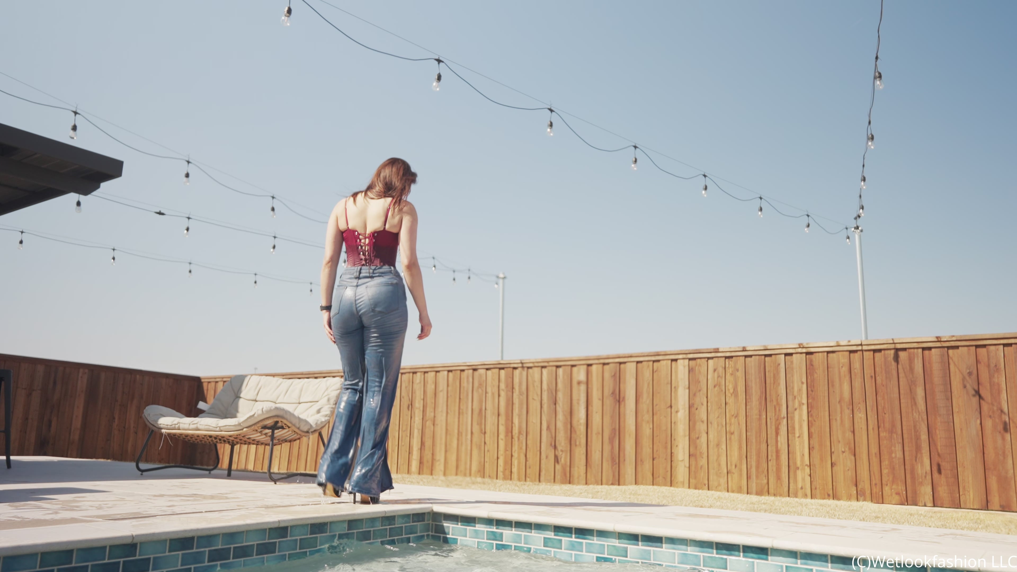 Samantha Dives in the Pool Wearing Jeans and a Red Corset
