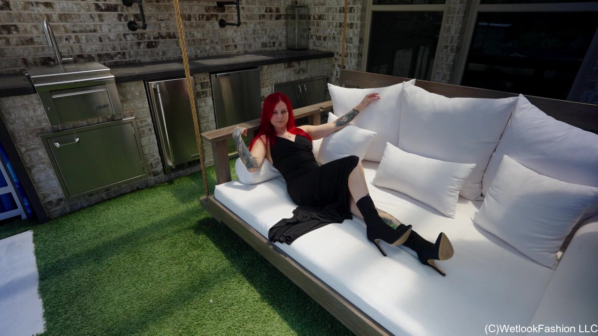 Scarlet Goes for a Swim in a Long Black Dress and Boots