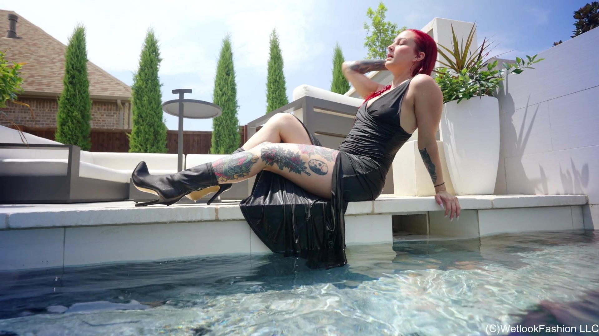 Scarlet Goes for a Swim in a Long Black Dress and Boots