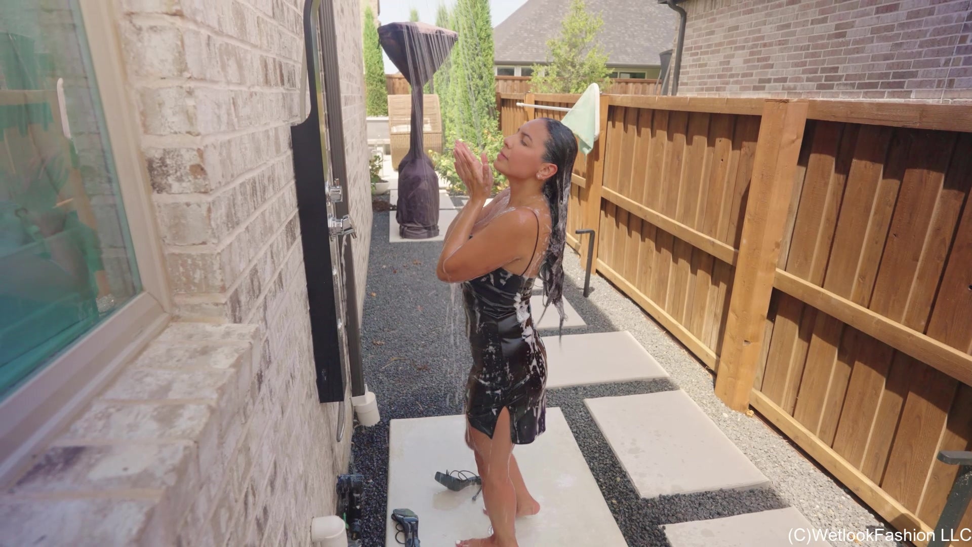 Selina Gets in the Pool a  Little Black Satin Dress