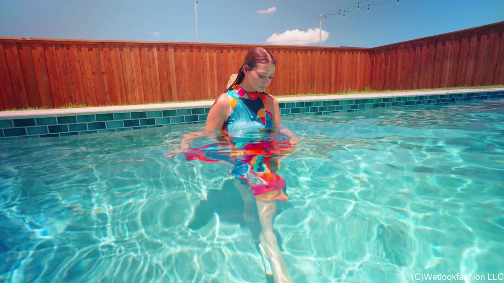 Taylor Falls in the Pool Wearing a Colorful Maxi Dress