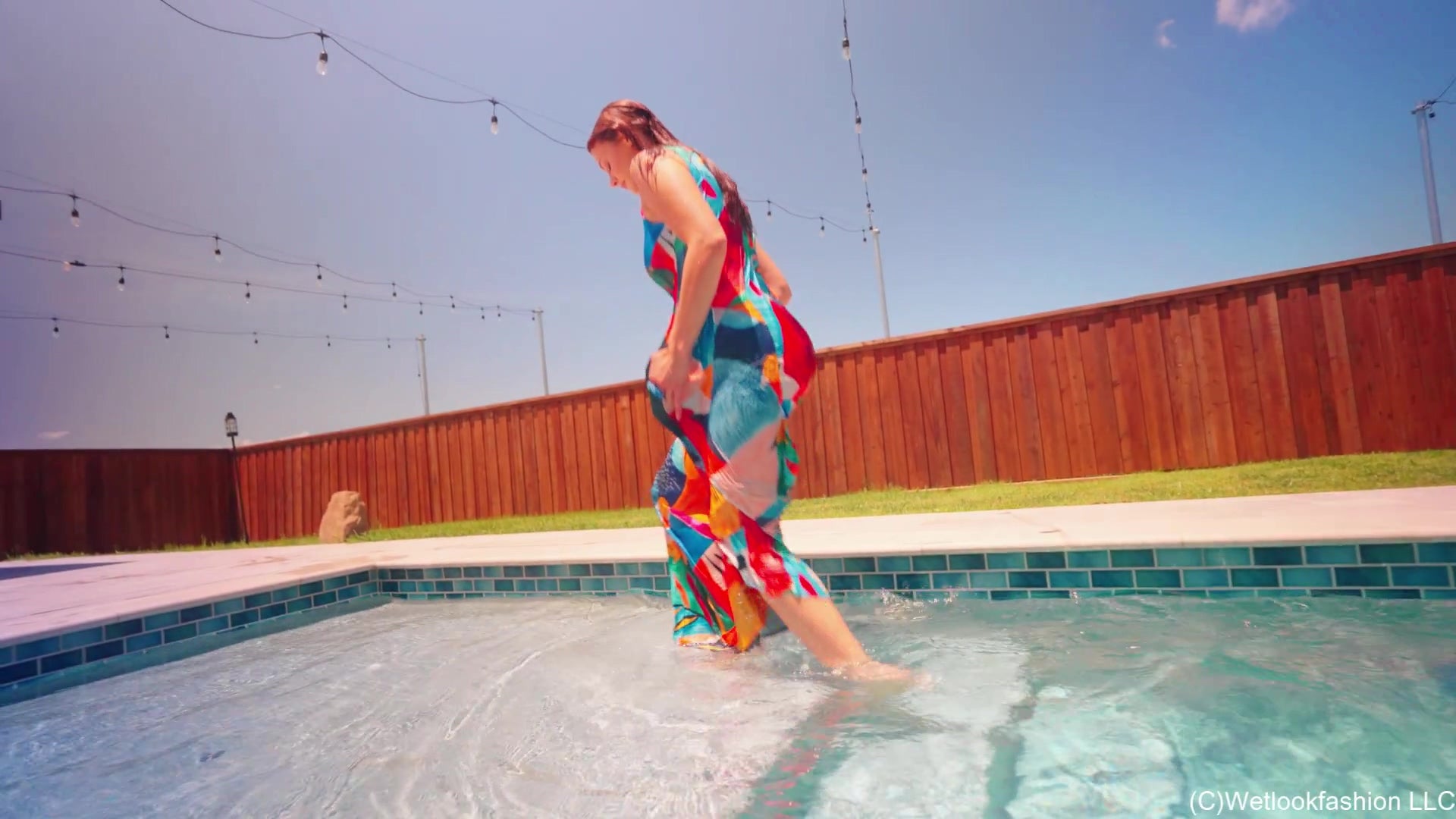 Taylor Falls in the Pool Wearing a Colorful Maxi Dress
