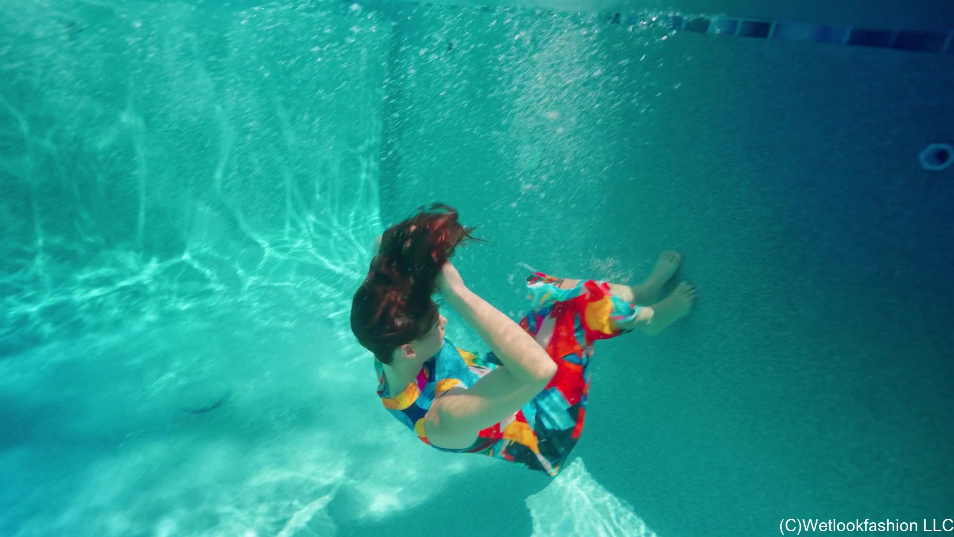 Taylor Falls in the Pool Wearing a Colorful Maxi Dress