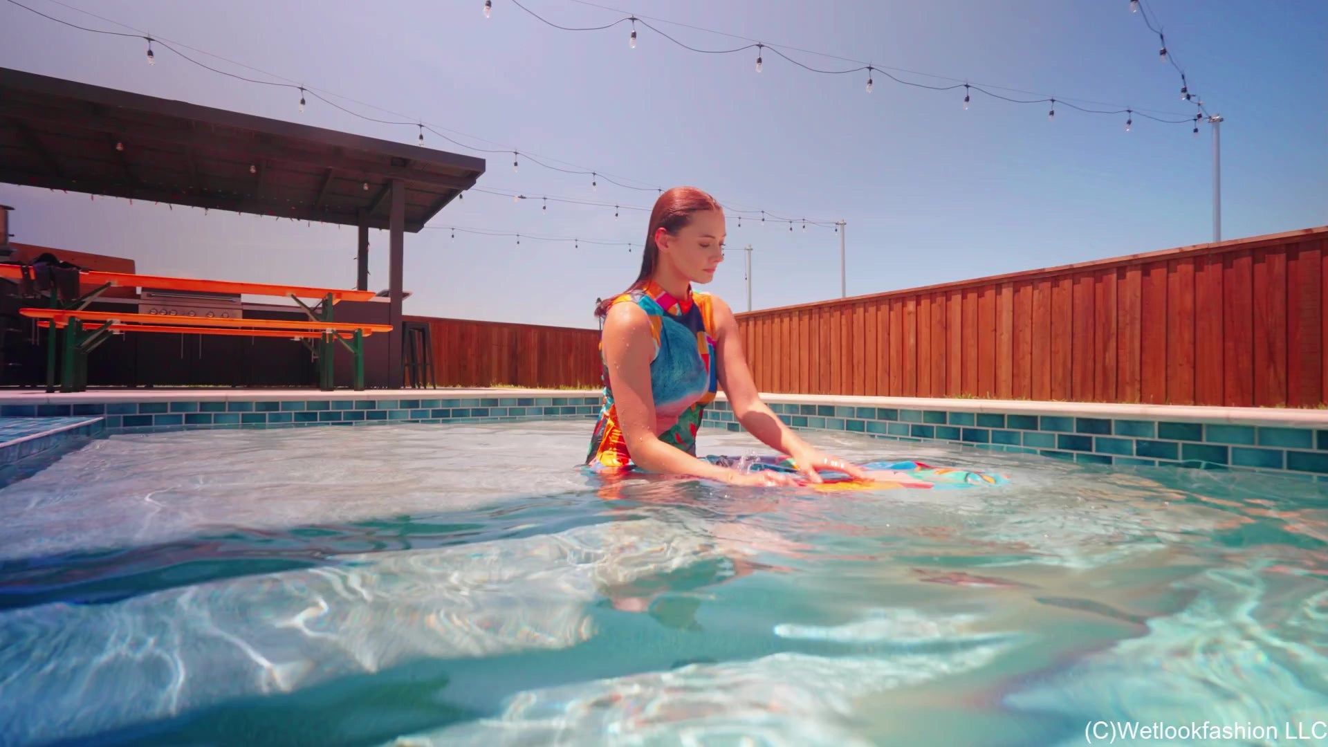 Taylor Falls in the Pool Wearing a Colorful Maxi Dress