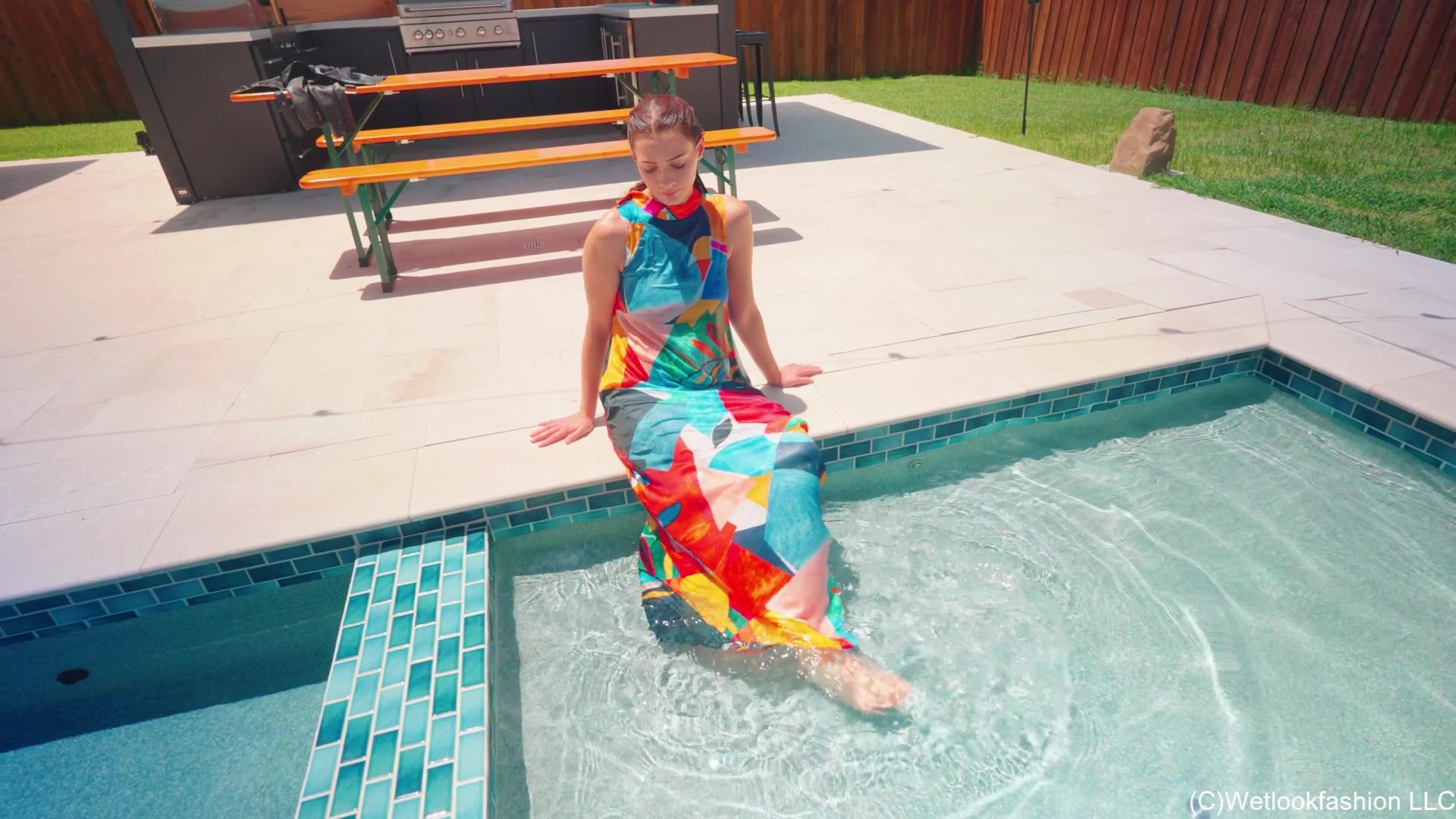 Taylor Falls in the Pool Wearing a Colorful Maxi Dress