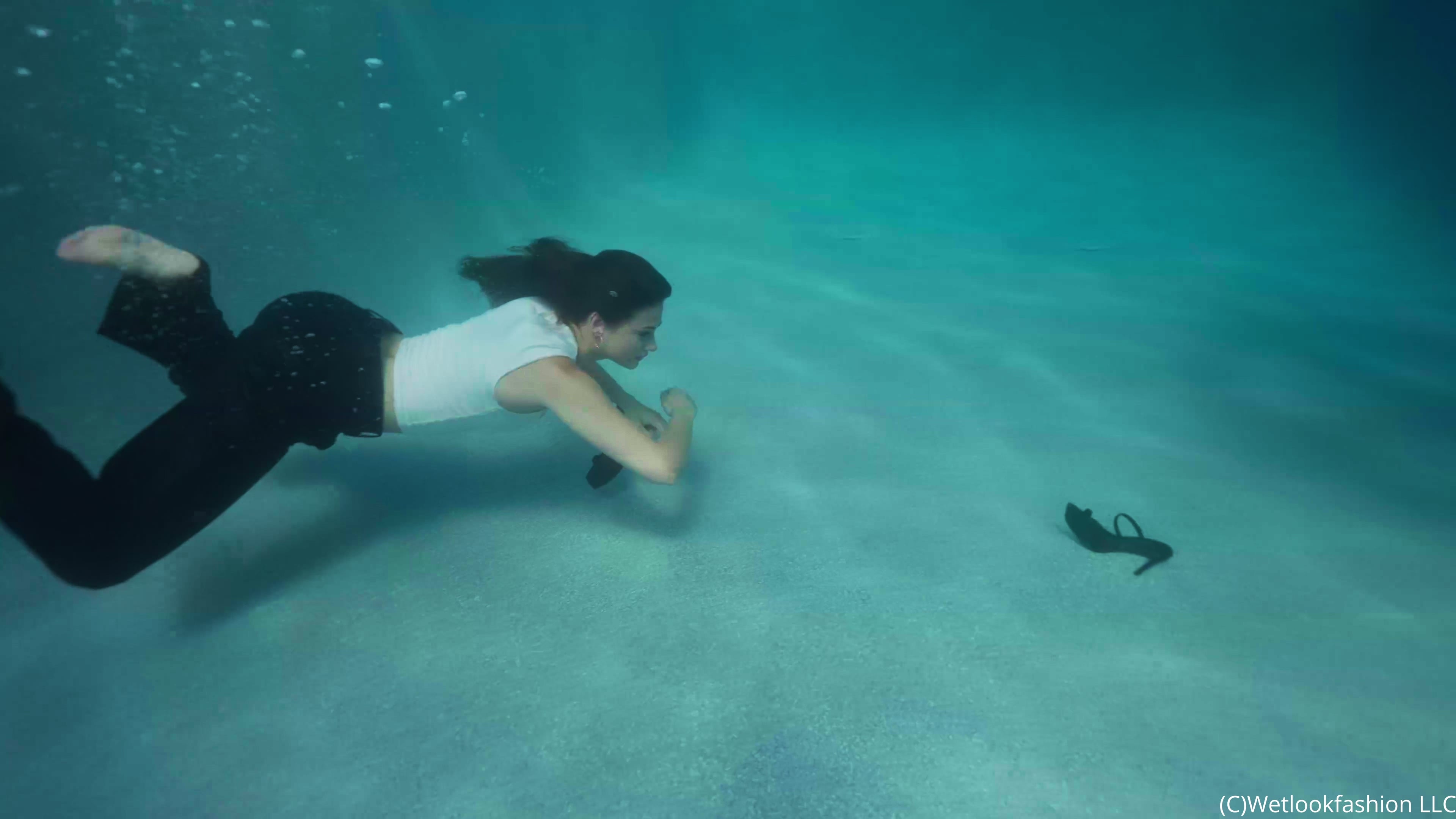 Taylor Takes a Pool Dip in Leather Pants and a Coat