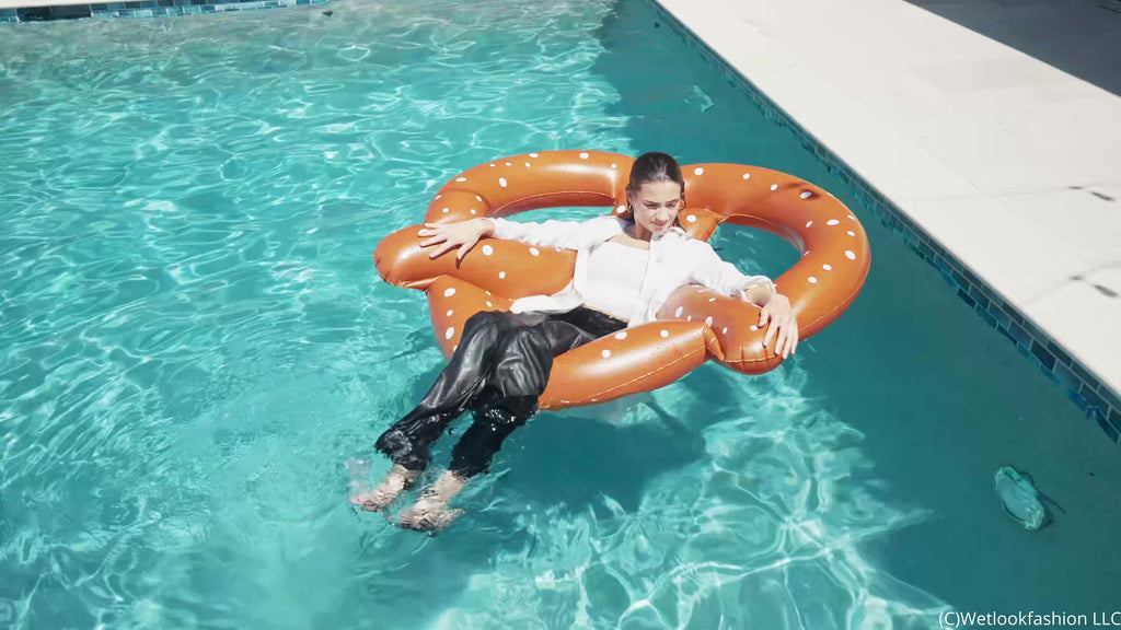 Taylor Takes a Pool Dip in Leather Pants and a Coat