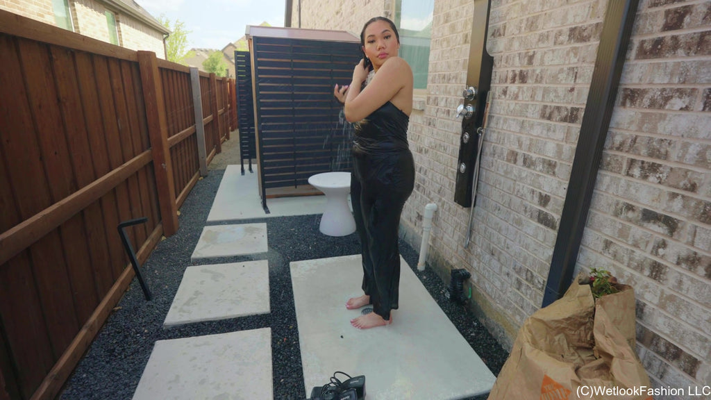 Tina Takes a Dip in the Pool Wearing a Shiny Jumpsuit