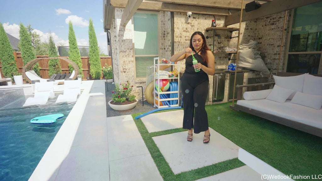 Tina Takes a Dip in the Pool Wearing a Shiny Jumpsuit