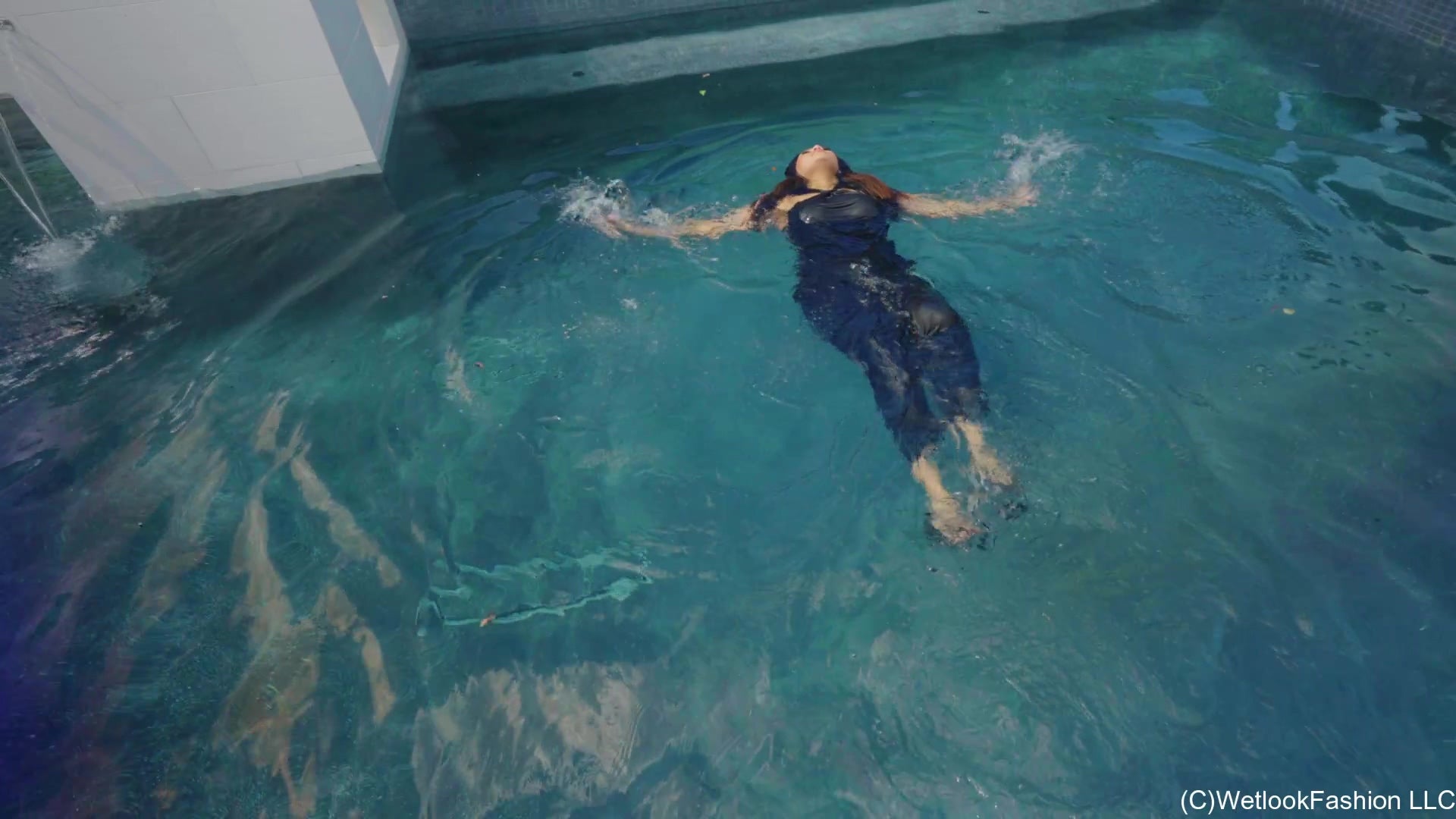 Tina Takes a Dip in the Pool Wearing a Shiny Jumpsuit