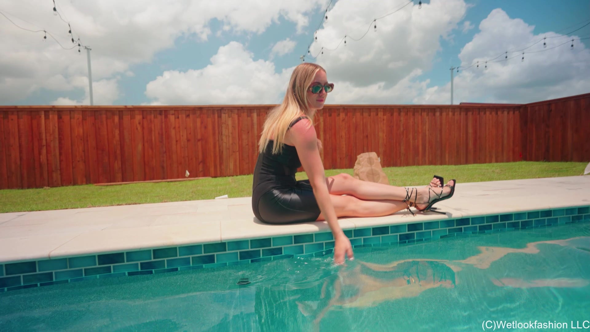 Victoria Gets Wet in a Shiny Little Black Dress