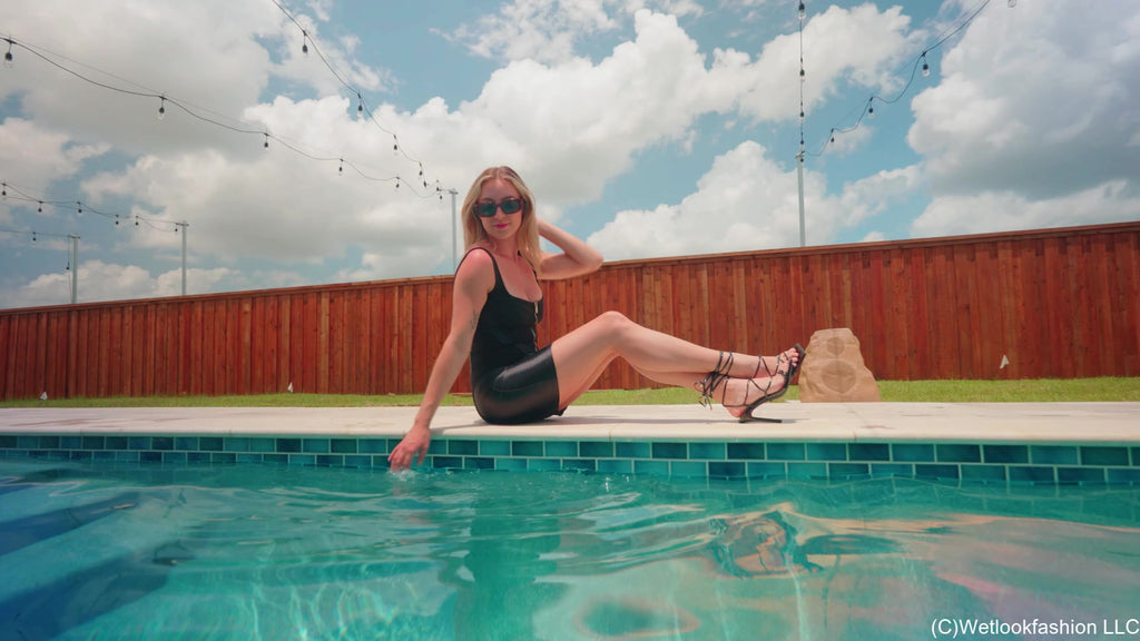 Victoria Gets Wet in a Shiny Little Black Dress