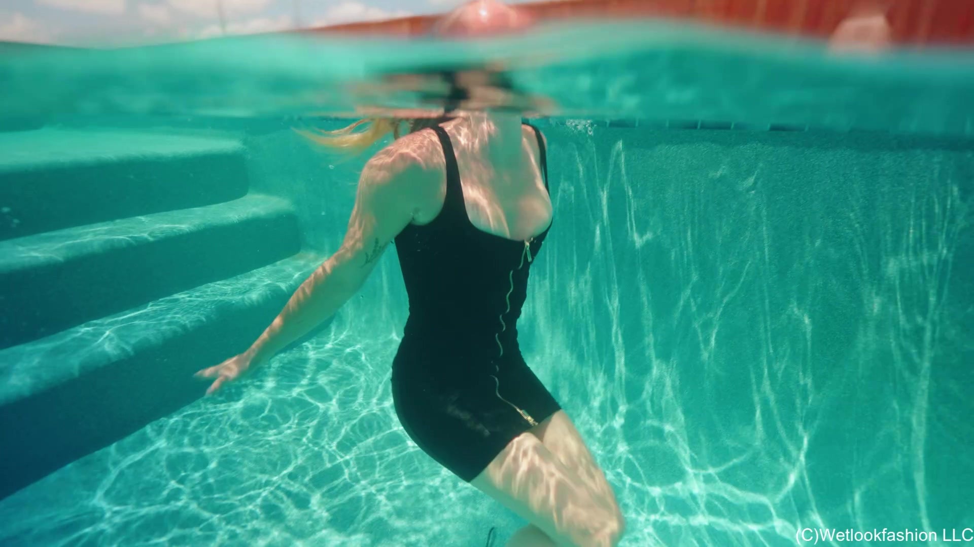 Victoria Gets Wet in a Shiny Little Black Dress